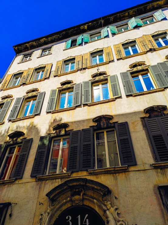 a building with a clock and many windows