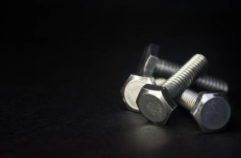 hex head nuts on the black background