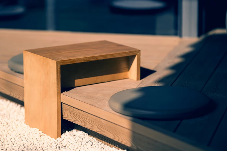 a wooden table on a wooden floor near a window