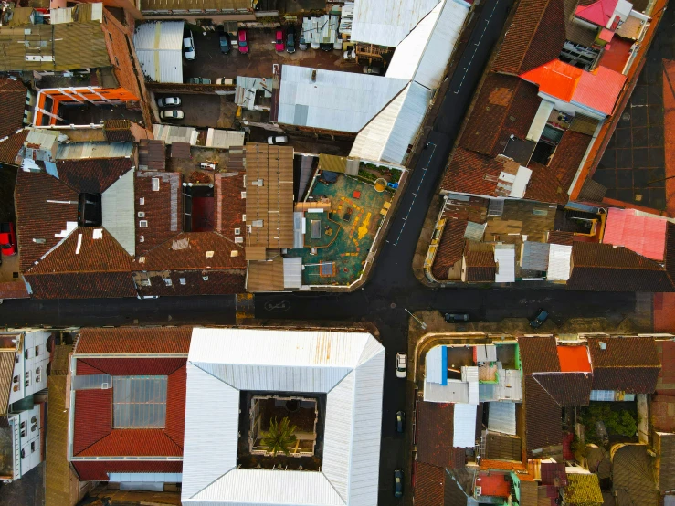 an aerial po of a house that has red tiles on it