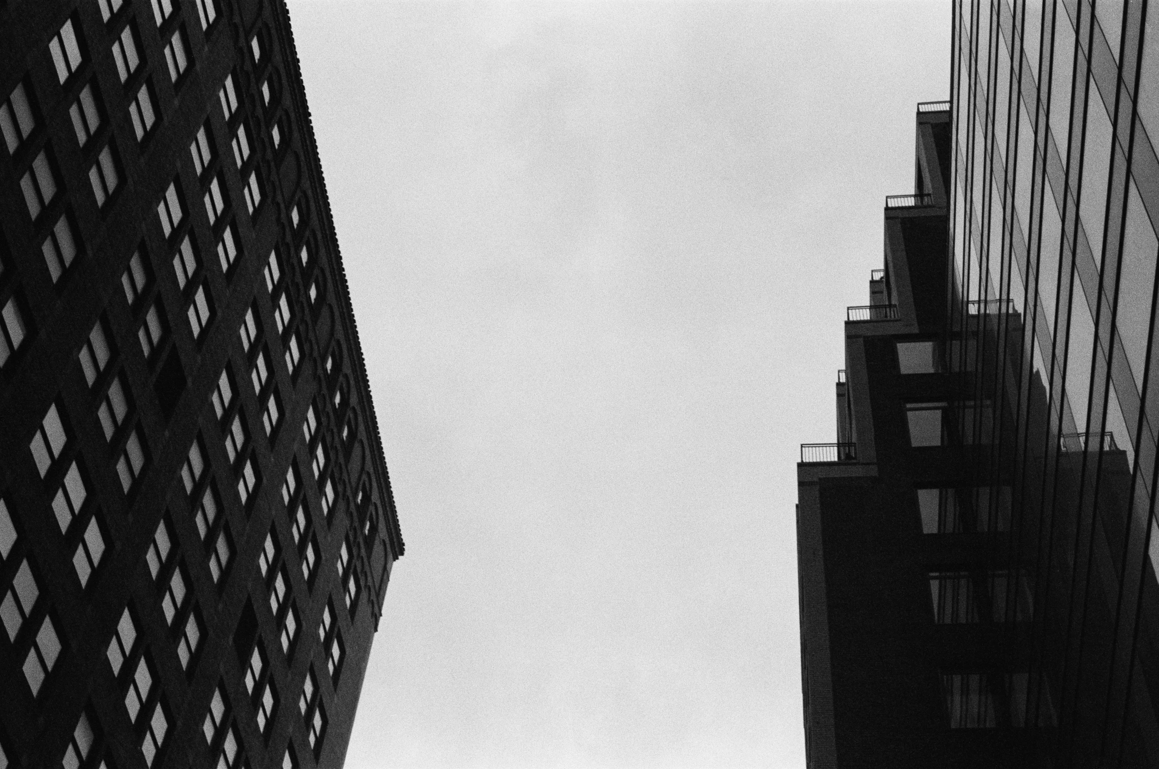 looking up at the sky between two buildings