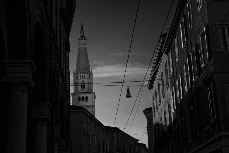 black and white po of buildings in front of a cathedral