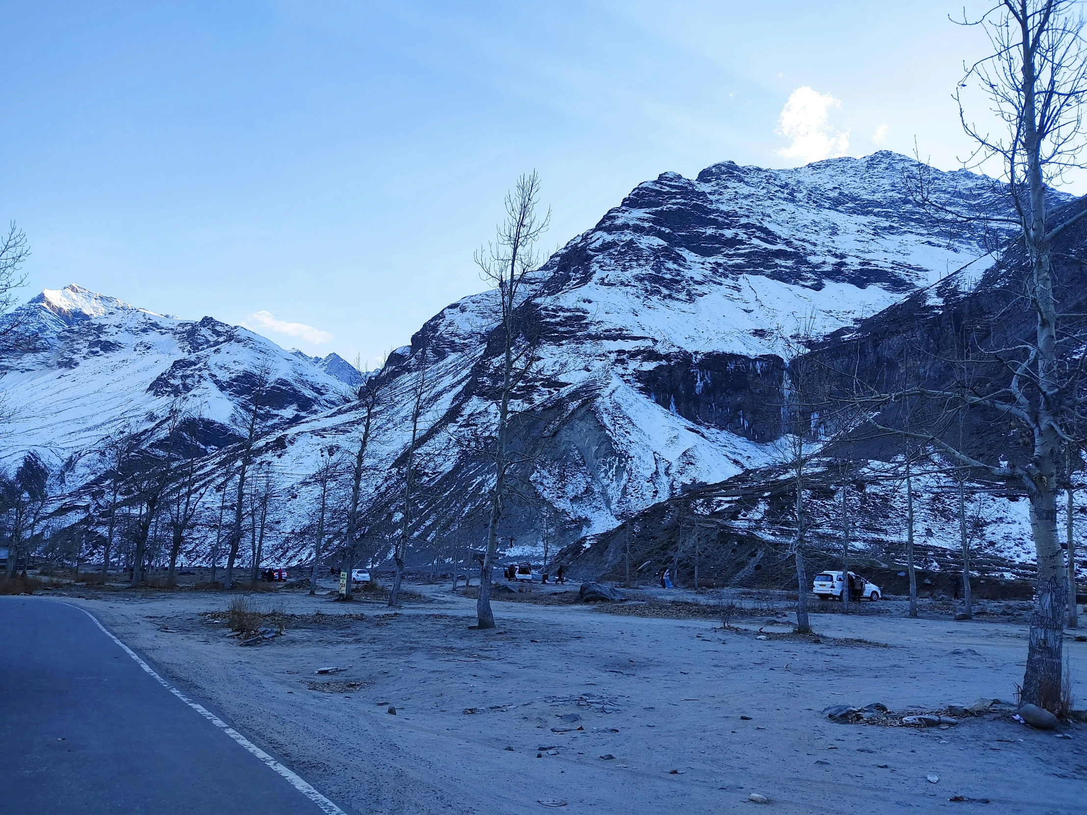 some very tall mountains covered with snow