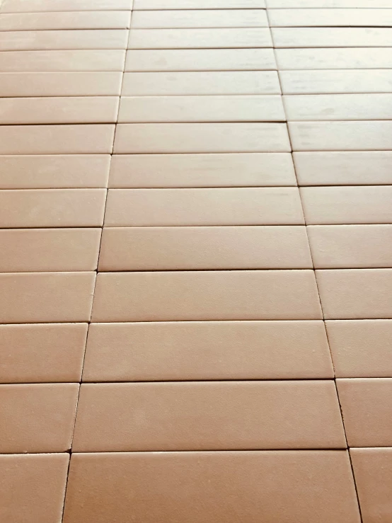 a tile floor with a line of lines that point out where the tiles are