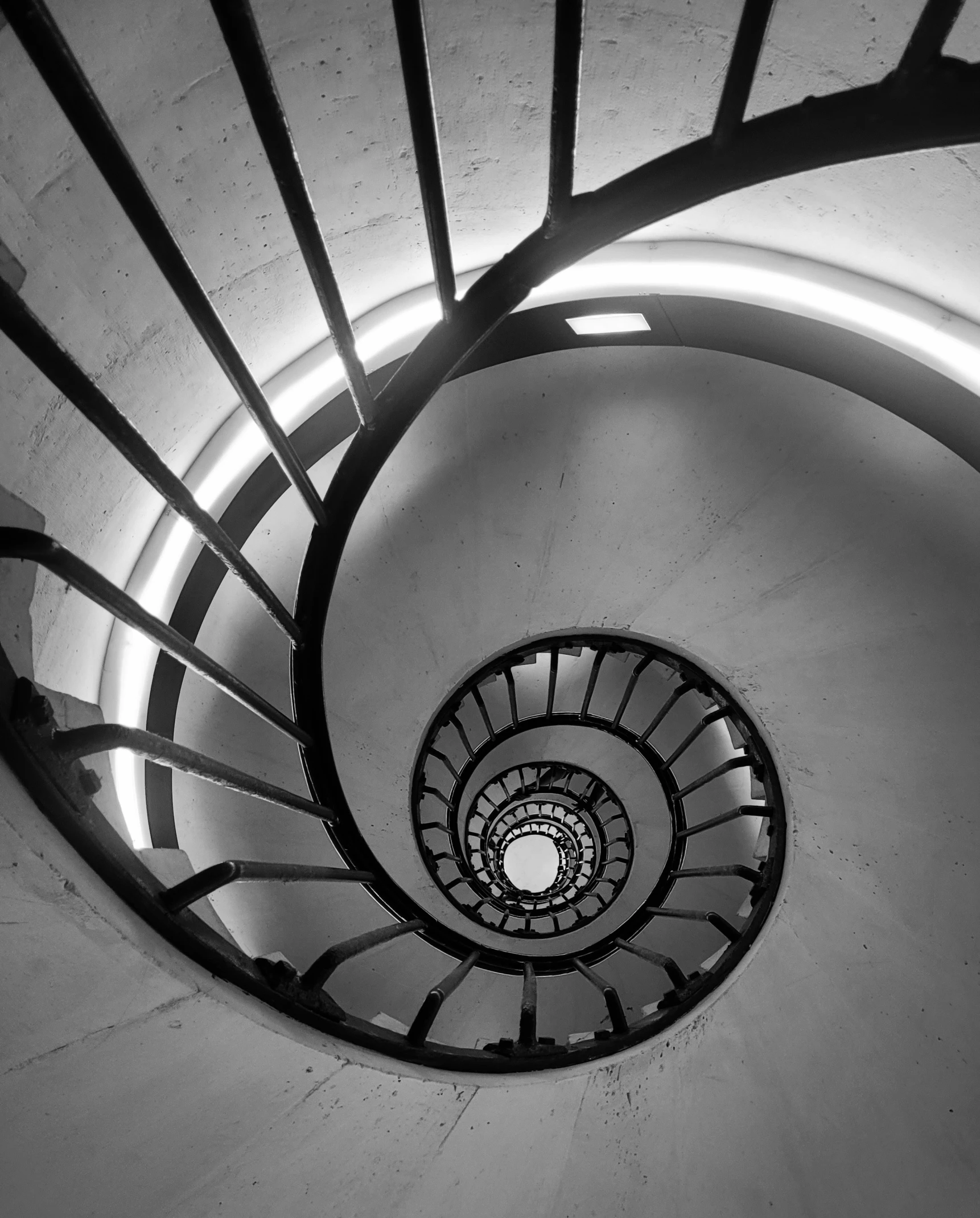 there is a spiral staircase that looks down