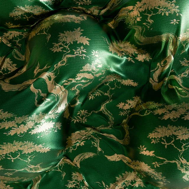 a shiny golden floral pattern on emerald green