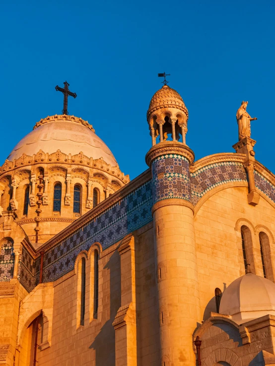 a very big pretty church with a large cross on top