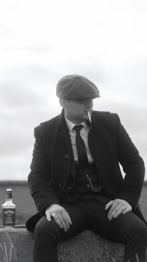 a black and white po of a man smoking a cigarette