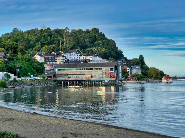 houses on the shore of a small beach