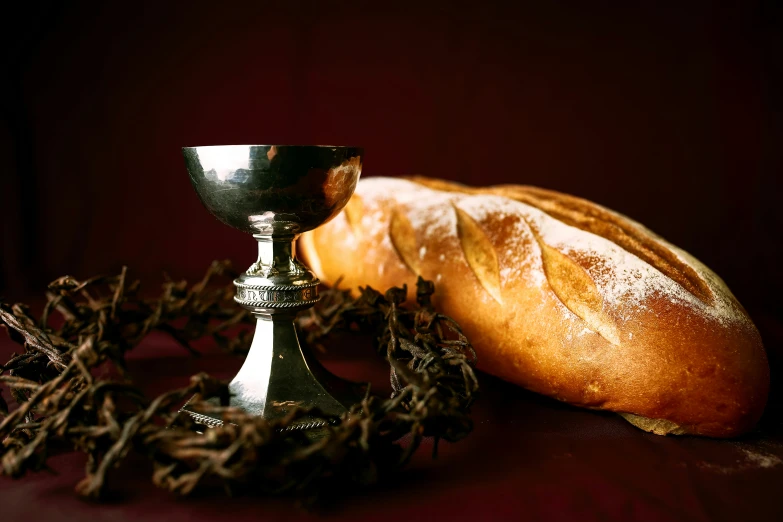 a small chalice and a plate of bread