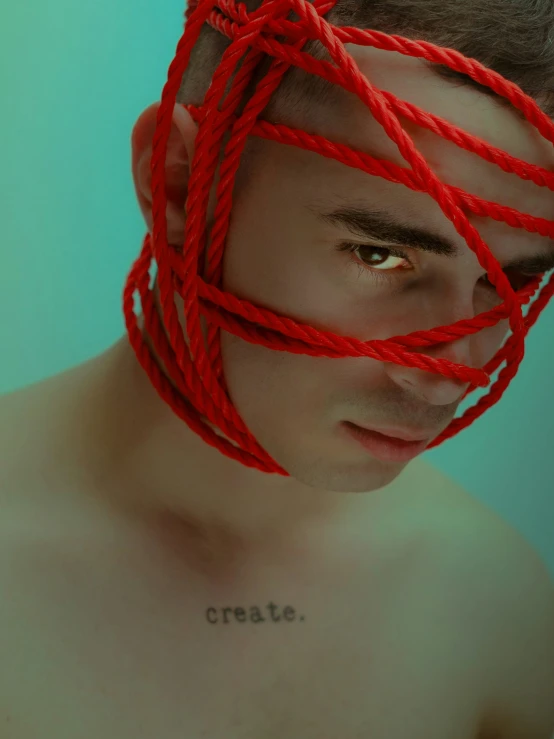 the man is surrounded by red string and words written in the word crayoe