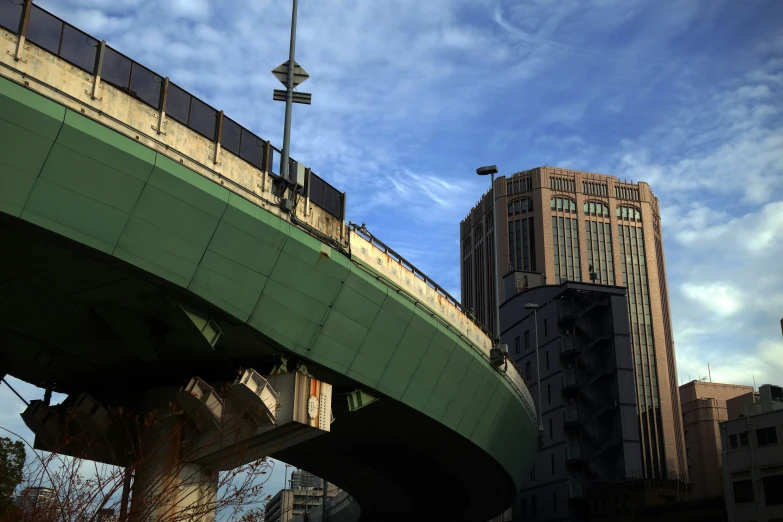 a bridge with a traffic light in the city