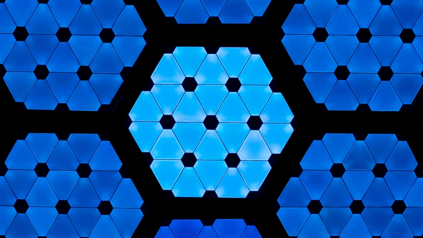 a blue hexagon pattern with dark background