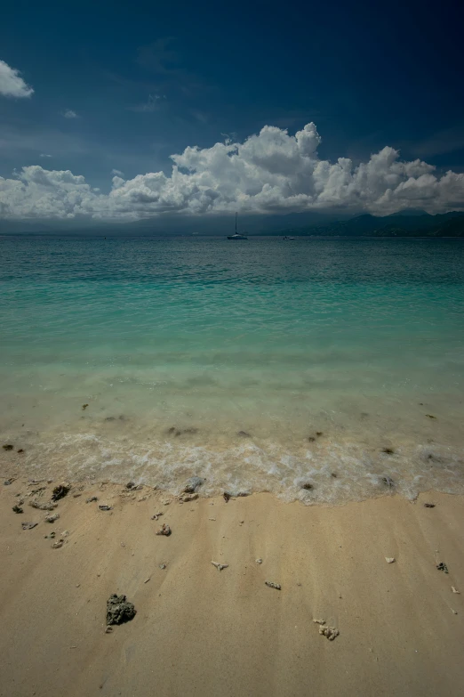 an ocean view shows water, sand and small seas