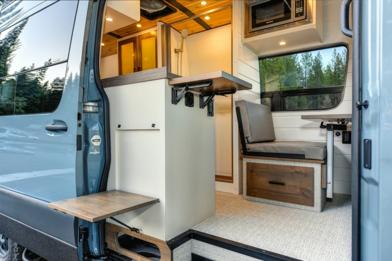 the interior of a camper with its doors open