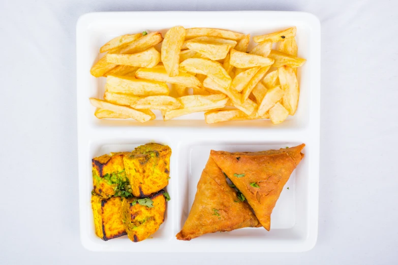 three types of food arranged in two separate trays