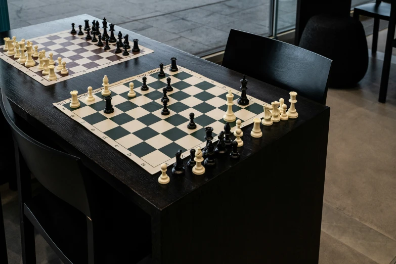 a set of chess on a table in an office