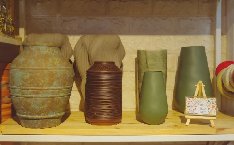 vases are on a shelf in a shop