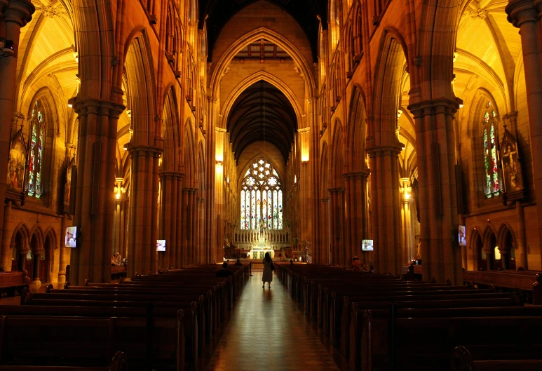 this is inside of a church with high ceilings and tall columns