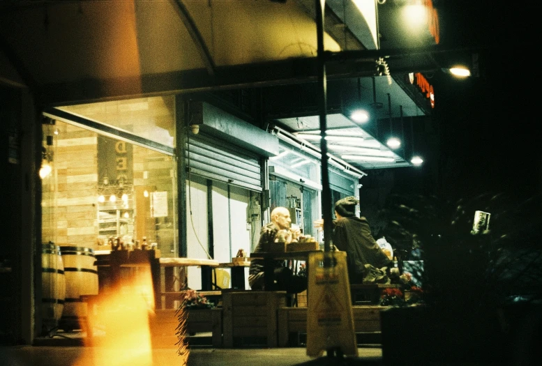 a woman in the front window of a restaurant