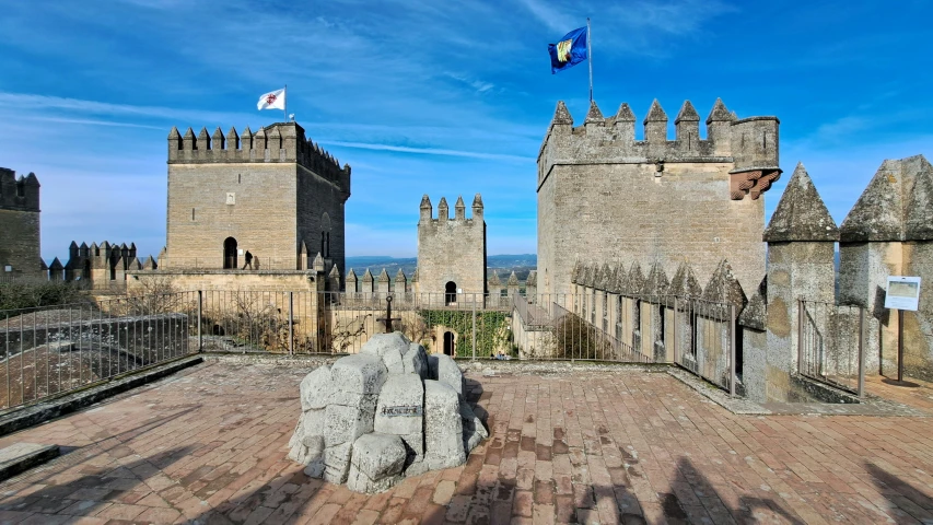 two medieval castle ruins are pictured from the ground