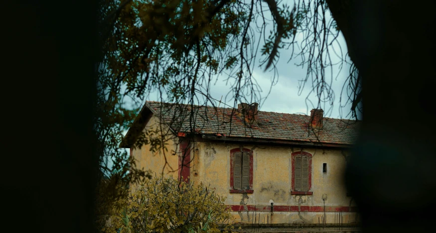 an old style house with a window open