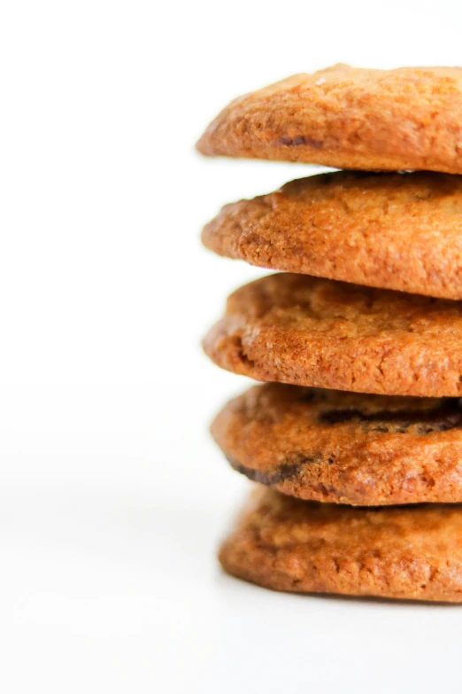 a stack of cookies on a white surface