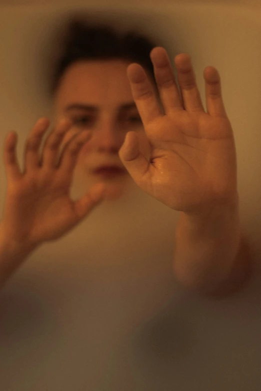 the reflection of a person taking a selfie in the mirror