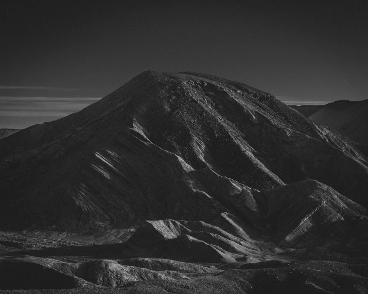 this is an aerial view of the top of a mountain in black and white