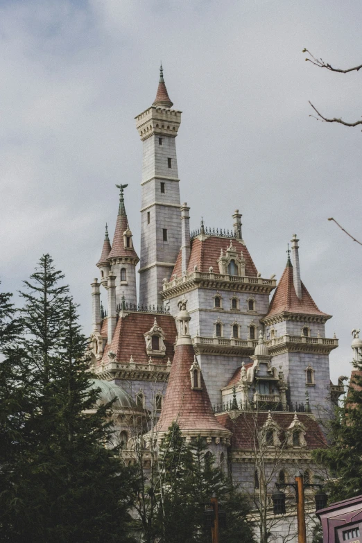 a castle that has red roof tops is in the daytime