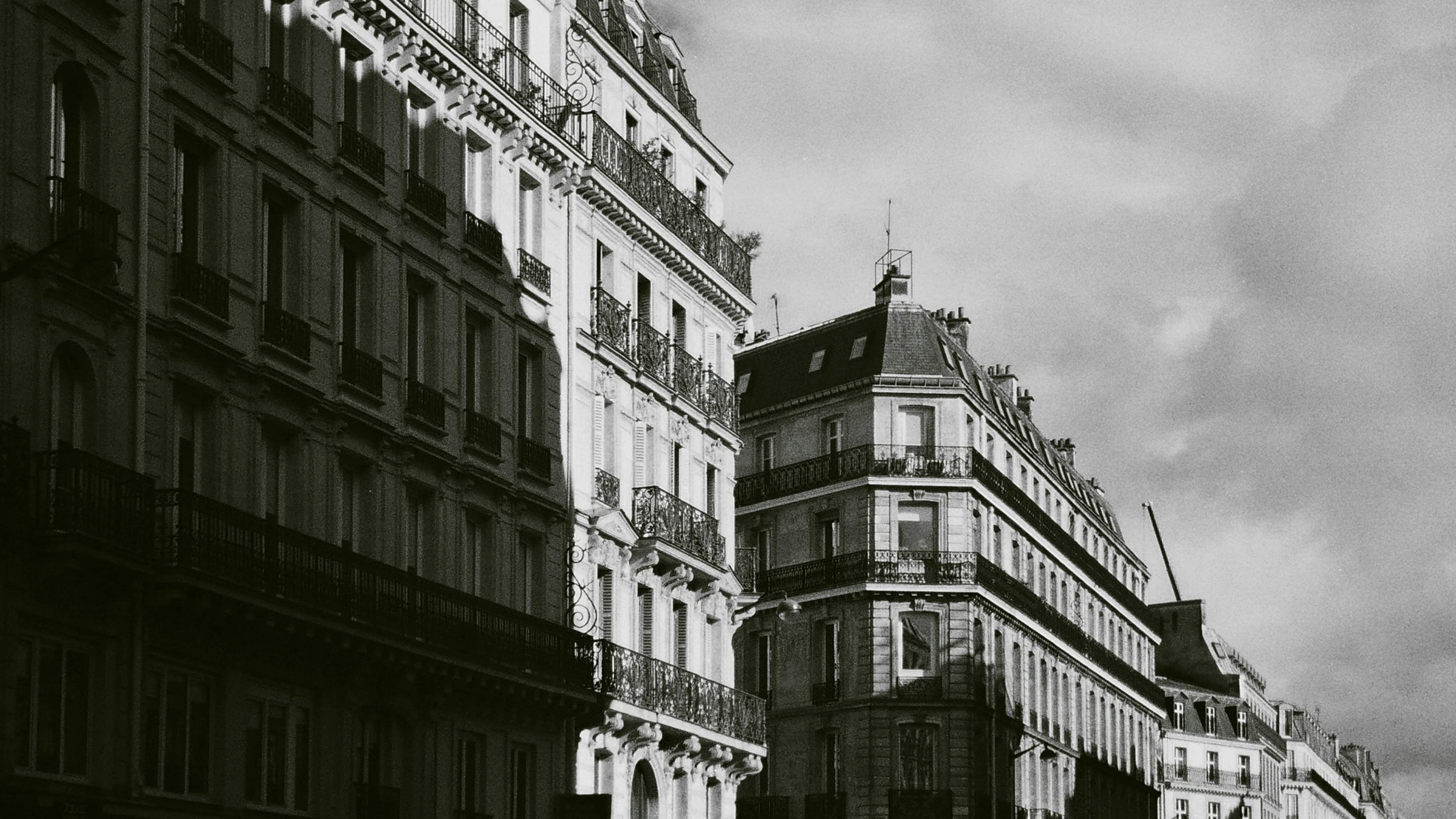 an old city street with many building in the background