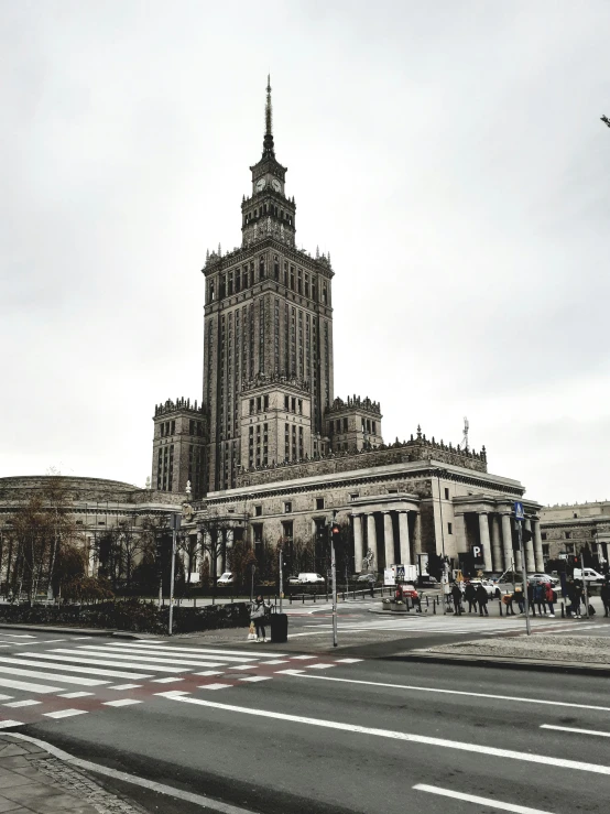 a very large building sitting on the corner of a road