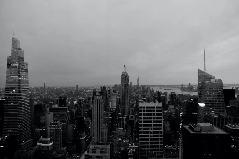 the view of a city with tall buildings and street lamps