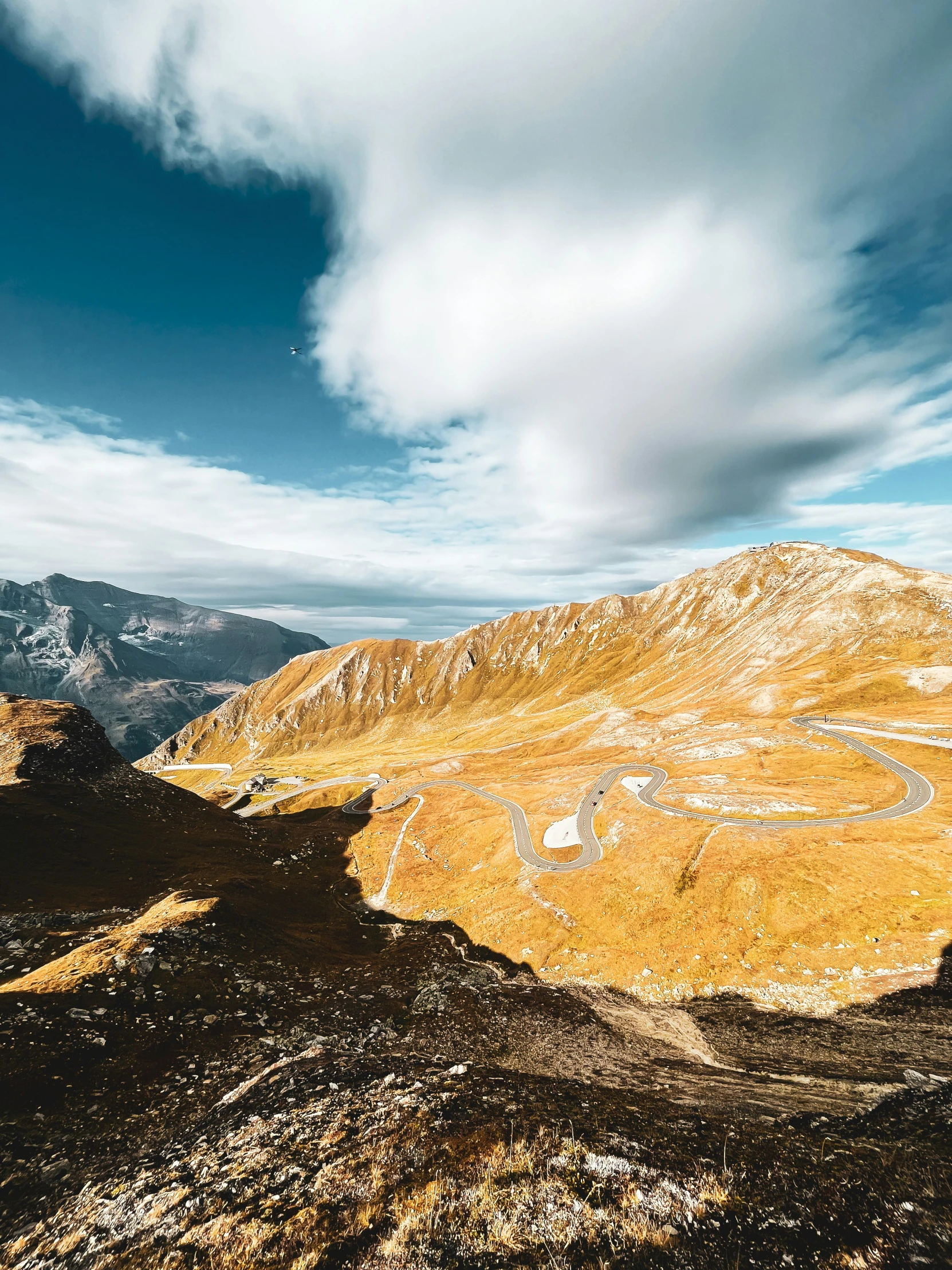 a hill that is next to some mountains