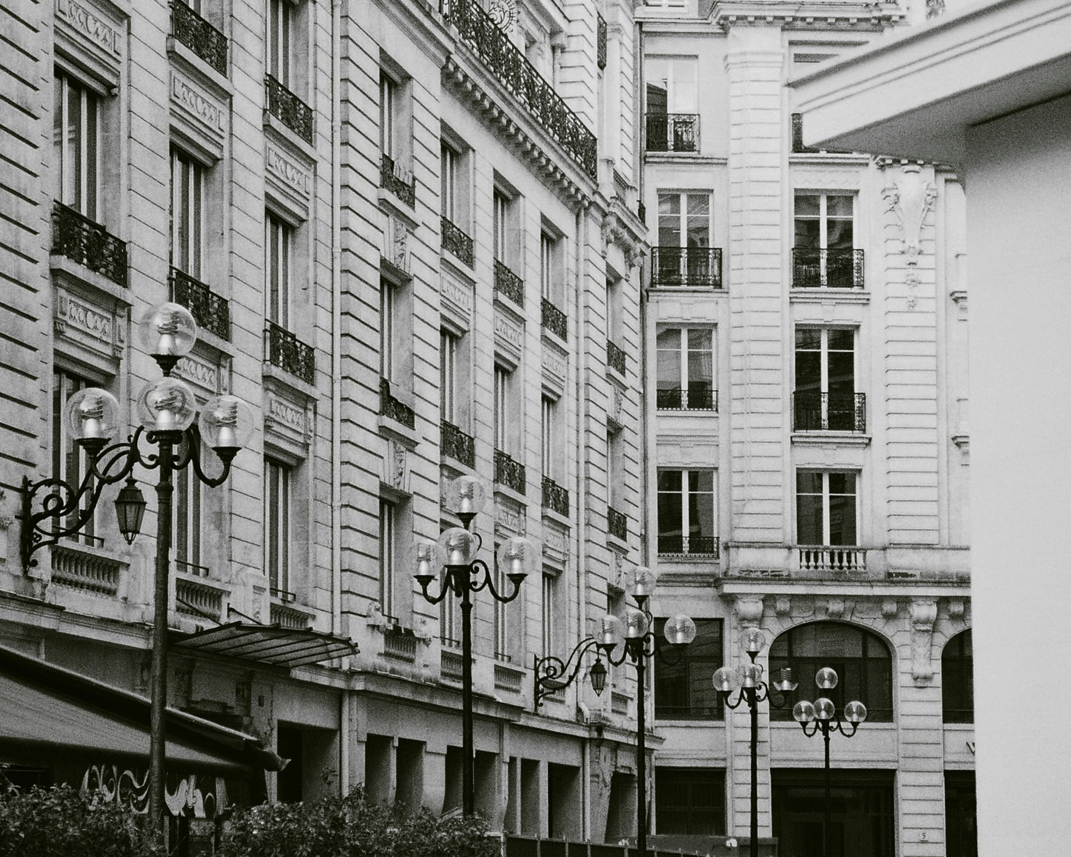 an old black and white pograph of people on the street