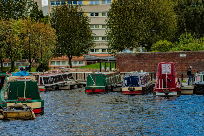 some boats on a river near some buildings