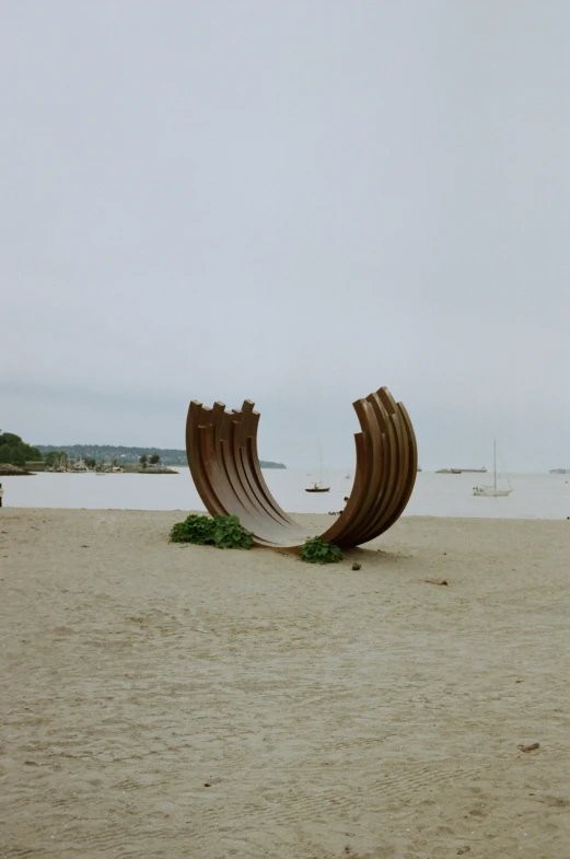 there are two boats in the sand on the beach