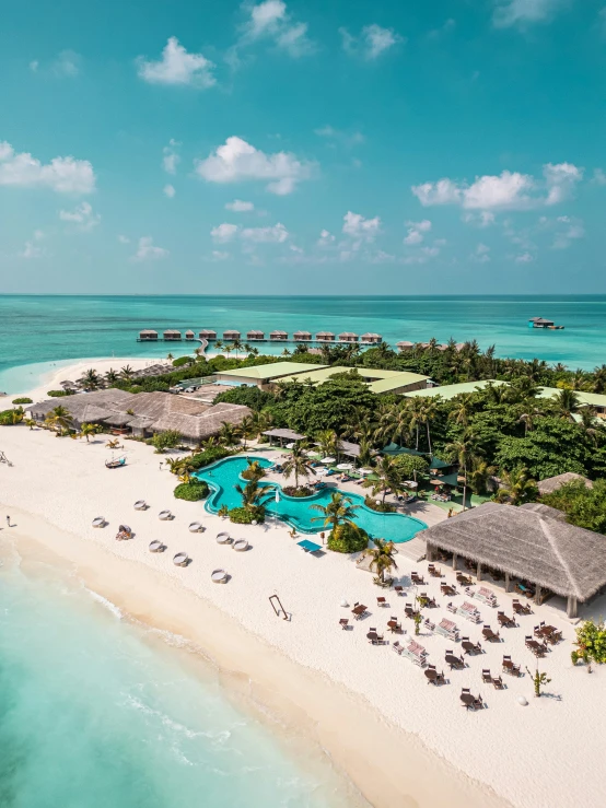 a beach view of some water and a resort