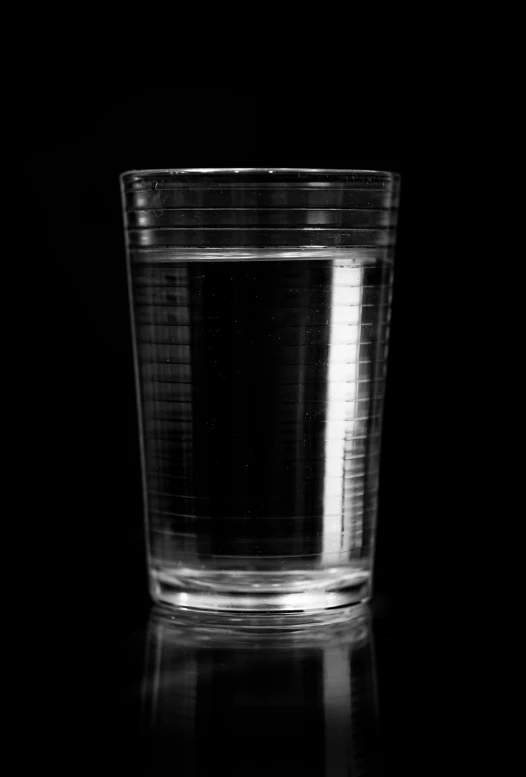 small glass in black and white pograph of the surface