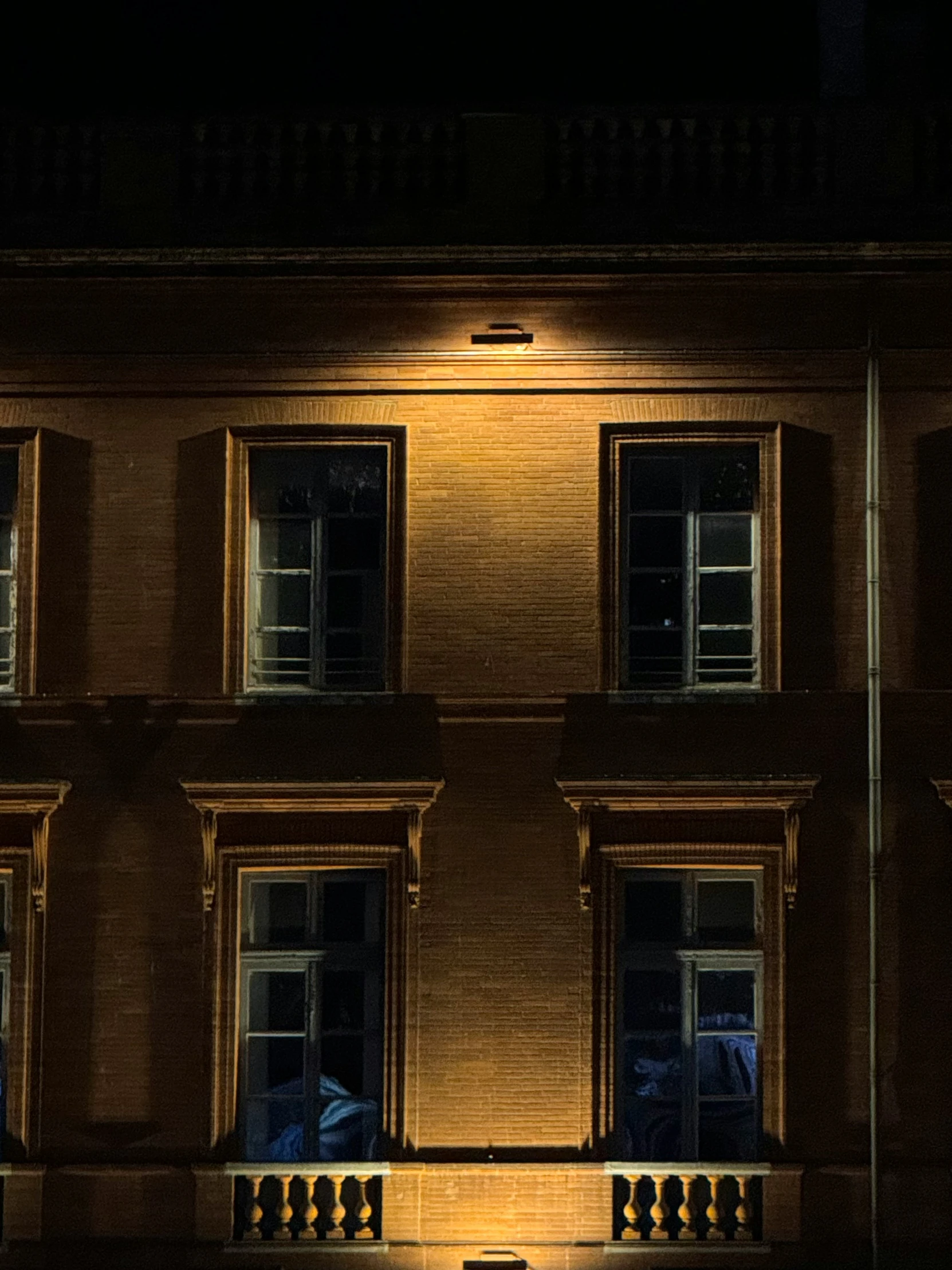 an image of a building at night with some lights