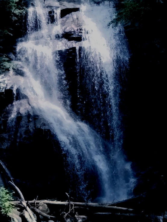 there is a man walking by a waterfall