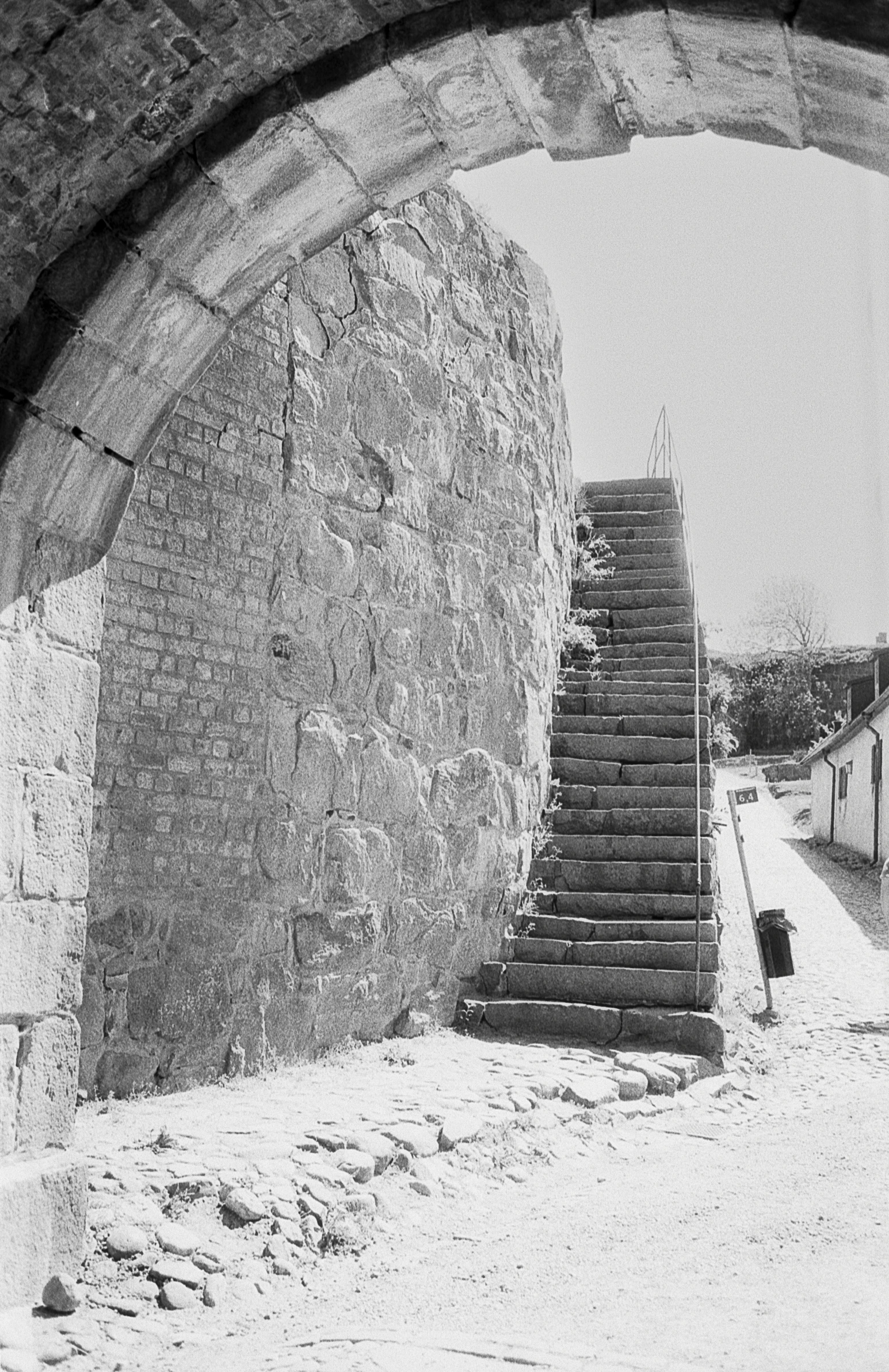 a stone tunnel that has some stairs