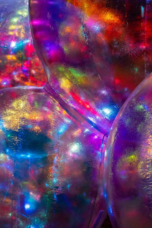 a group of shiny clear balls with colorful highlights