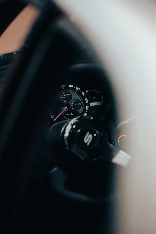 the dashboard and gauges of a motorcycle in a dark room