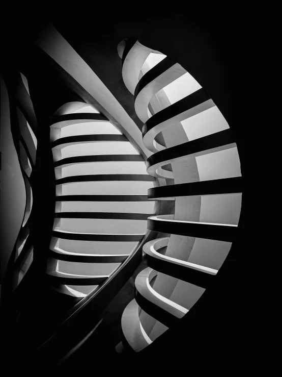 a spiral stair case with abstract lines and stripes on black