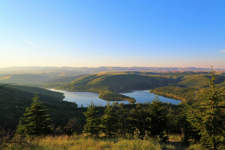 a scenic view from a hilltop with lots of water in it