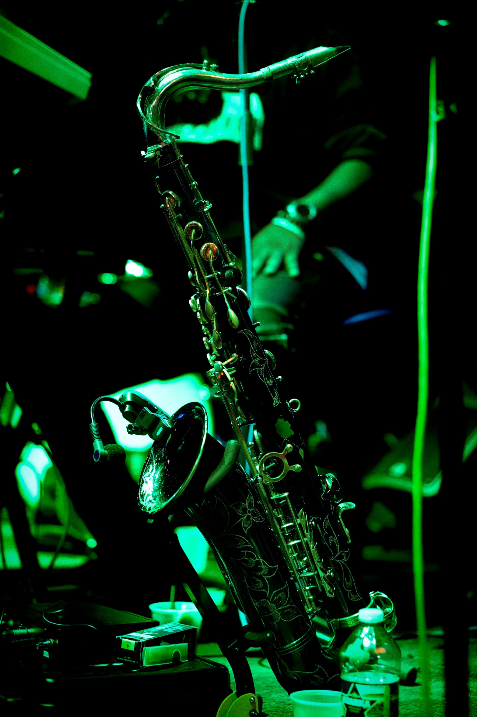 a close up of a saxophone on a dark stage