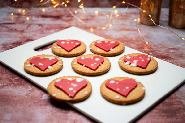 some heart cookies are arranged on a tray