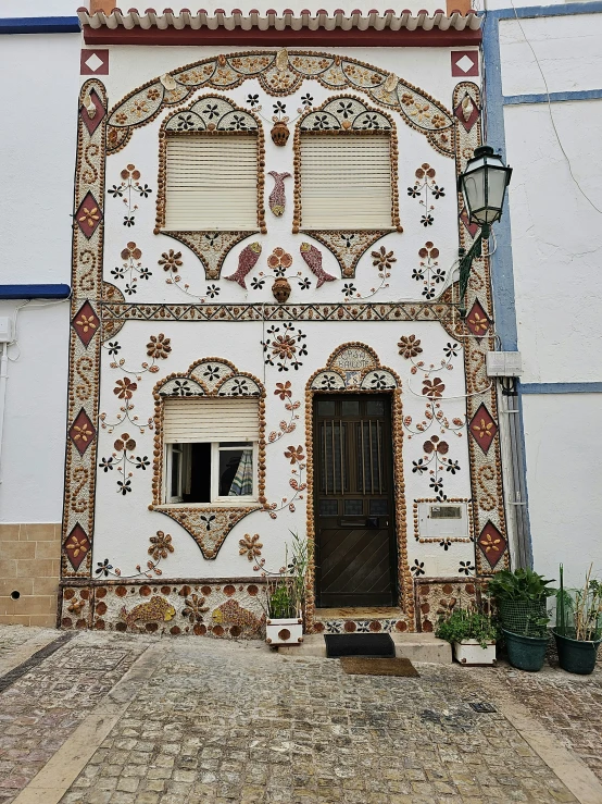 a decorative building with ornate wall and windows