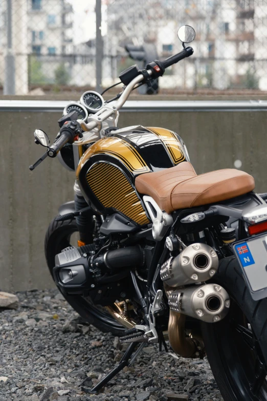 a motorcycle is parked outside with the city in the background